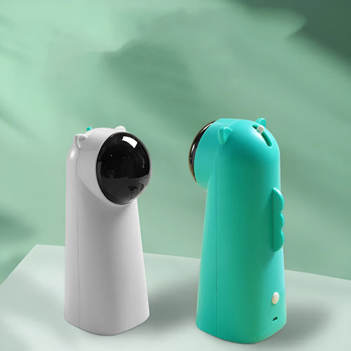 Automatic laser cat pole toy showing green with white plastic housing and LED red laser beam on floor