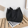 Solid colour canvas women's handbag with double shoulder straps and horizontal square shape