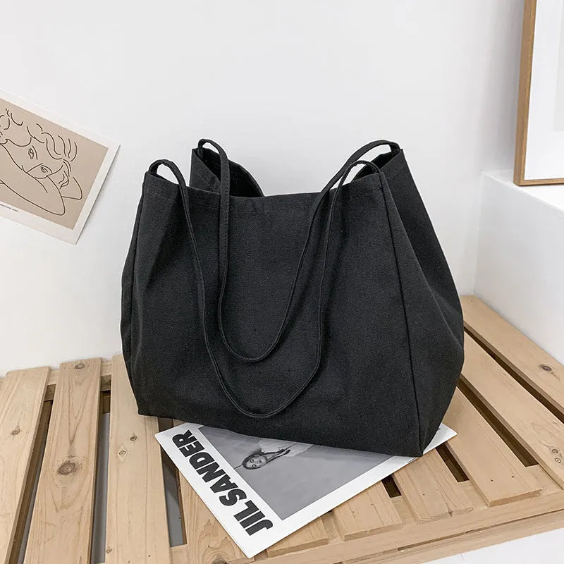Solid colour canvas women's handbag with double shoulder straps and horizontal square shape
