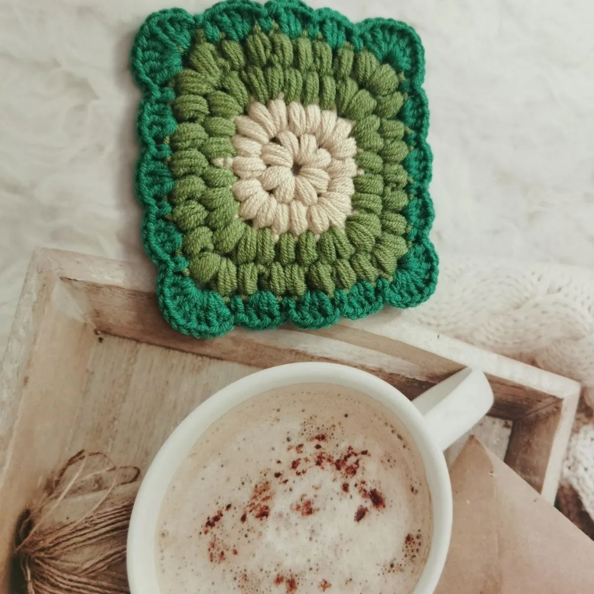 Crocheted wool cup placemat with Grandmother Lattice pattern in chosen colour