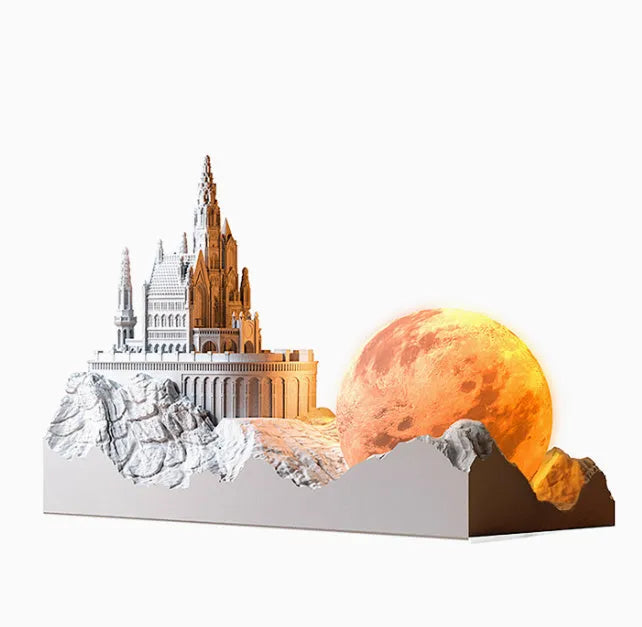 Mountain-shaped aromatherapy night light with touch control, LED lamp, essential oil and card gift set on a desk