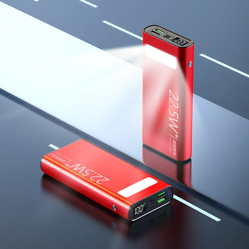 Black alloy 20000mAh power bank with LCD display showing battery level and USB ports.