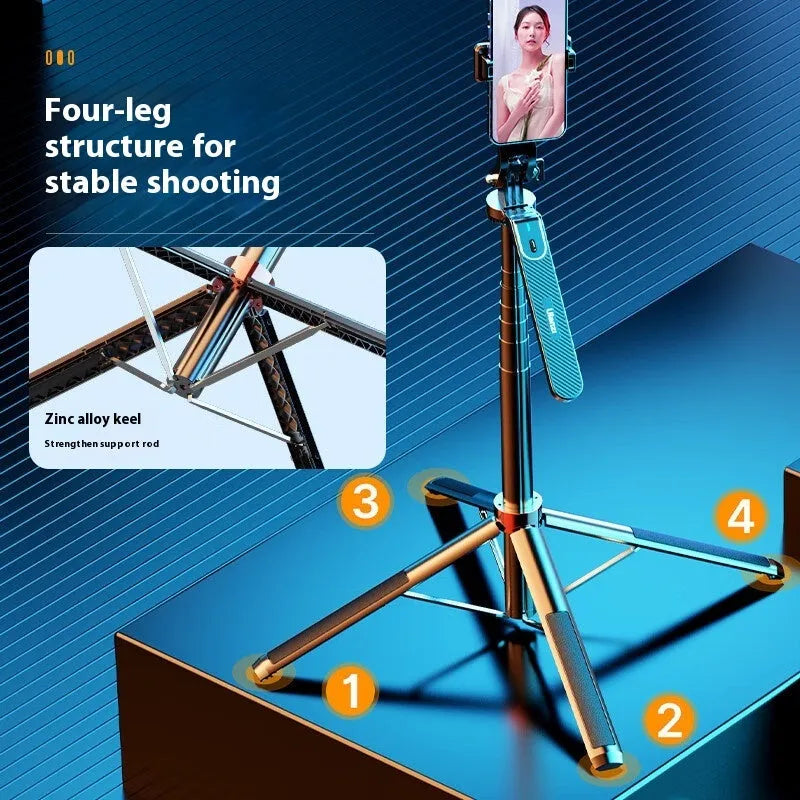 Bluetooth quadrupod selfie stick tripod with remote control, phone clamp, and four legs extended on a table