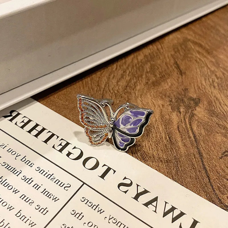 Copper butterfly women's ring with dripping oil texture and an open loop design.