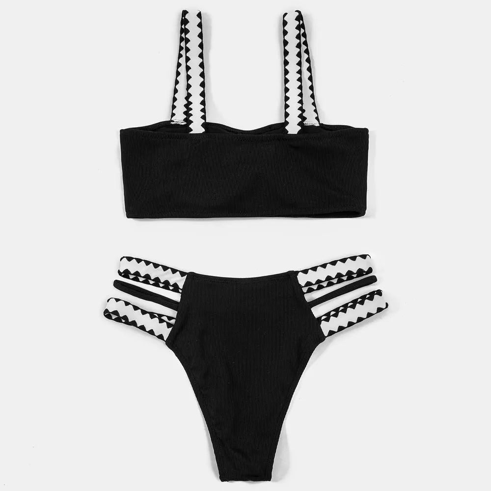 Black women's one-piece swimsuit with hollowed-out split design and briefs cut.