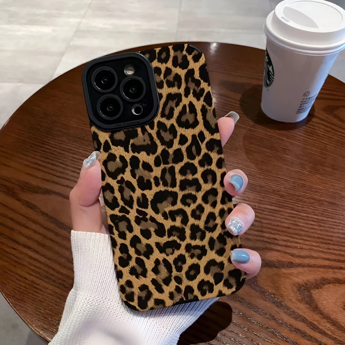 Brown leopard print iPhone 15 phone case with three-dimensional relief and TPU material.