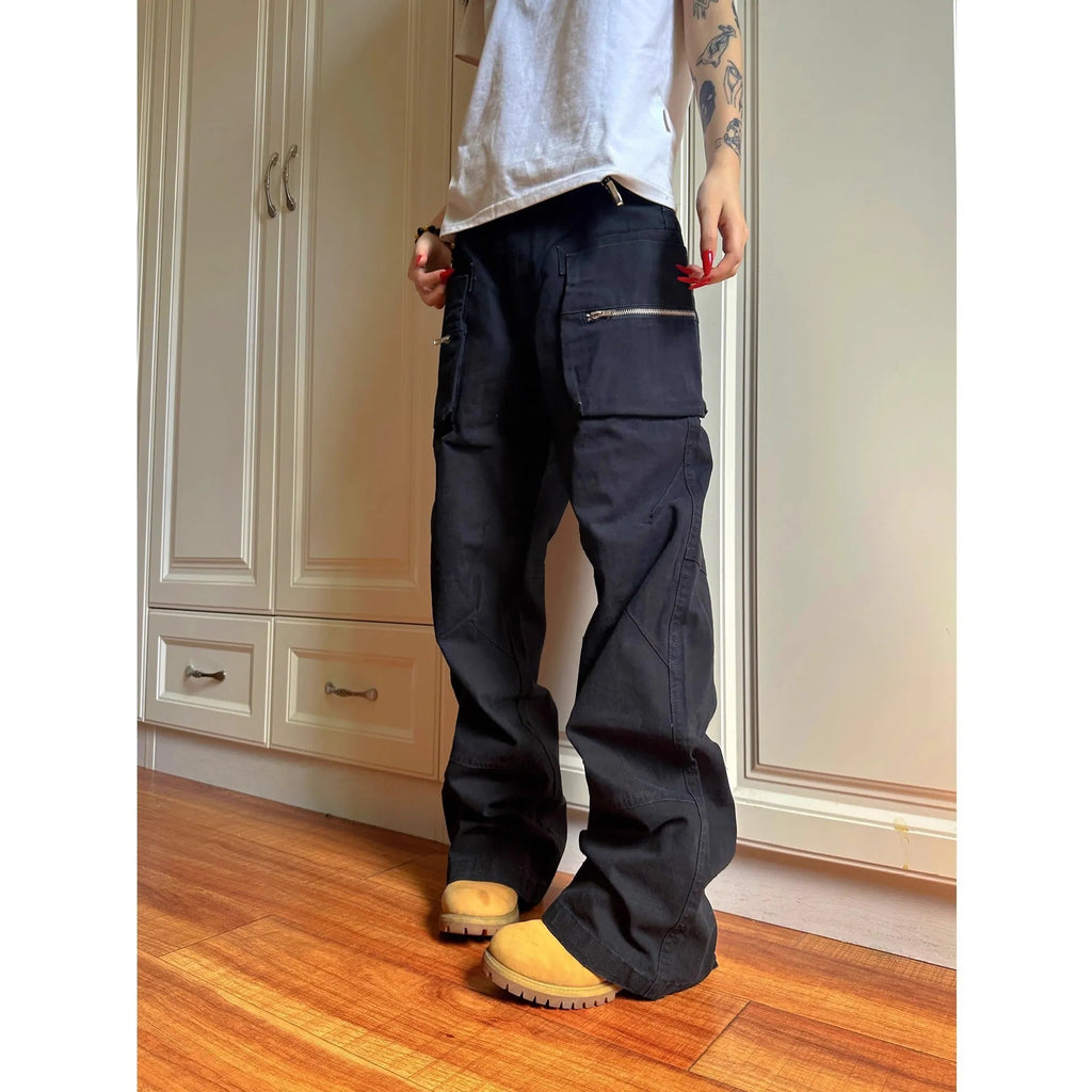 Green and black double zipper casual cotton pants with an elasticated waistband on a hanger.