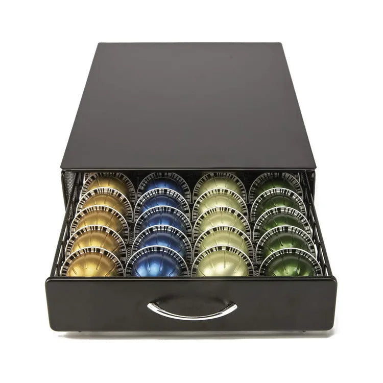 Black coffee capsule storage drawer with silver handle, 40x29x8.5cm, on a cafe countertop
