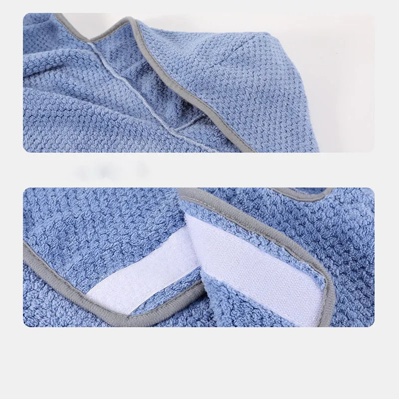 A blue dog bath robe towel with an adjustable waistband wrapped around a dog, showing the snap button closure.