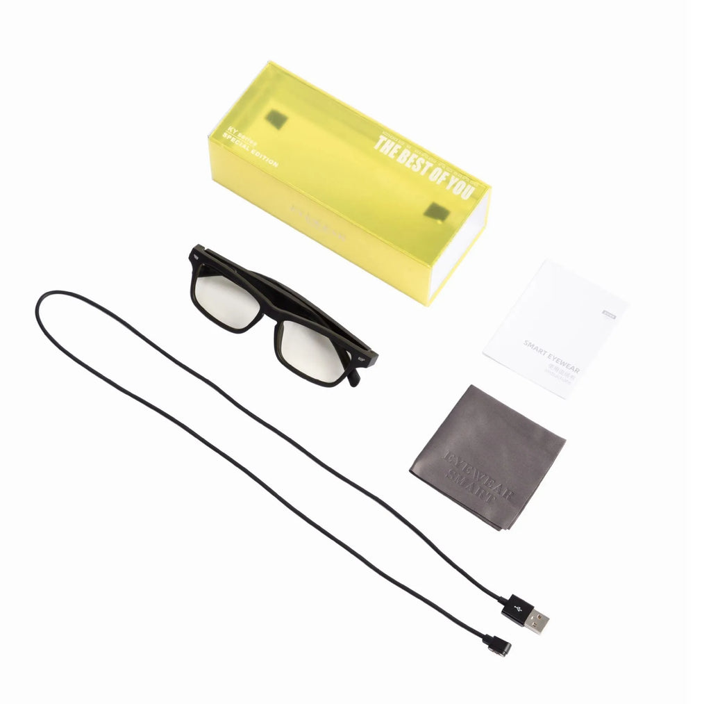 Unisex Bluetooth compatible smart glasses with open-ear design on a glasses case, with USB cable.