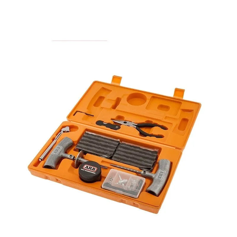 Emergency tyre repair tool kit in orange case with insertion tool, reamer, tyre gauge, and accessories.