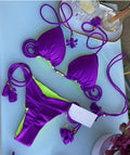 Braided bikini triangle bag swimsuit in blue with braided straps and bag-style bottoms on model