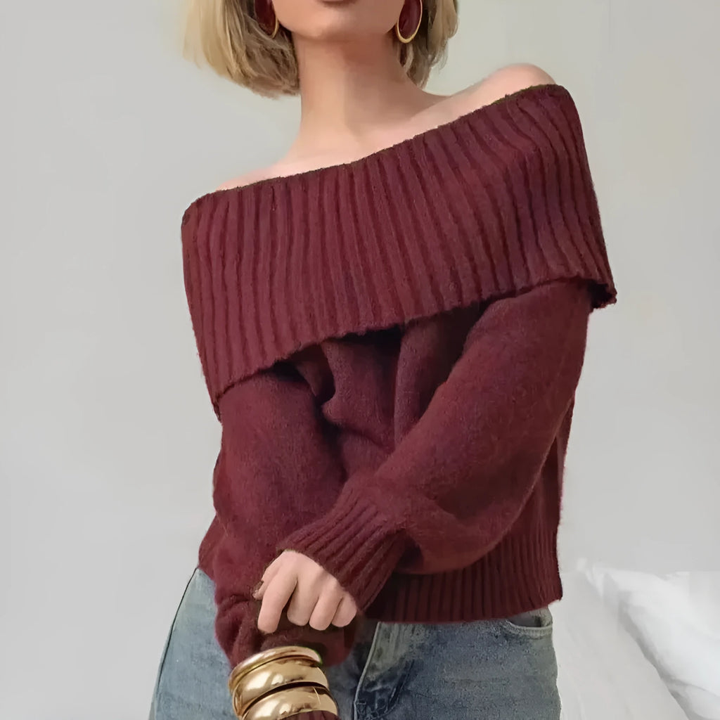 Grey off-the-shoulder women's sweater with a 3D knit pattern and strapless neckline on a hanger.