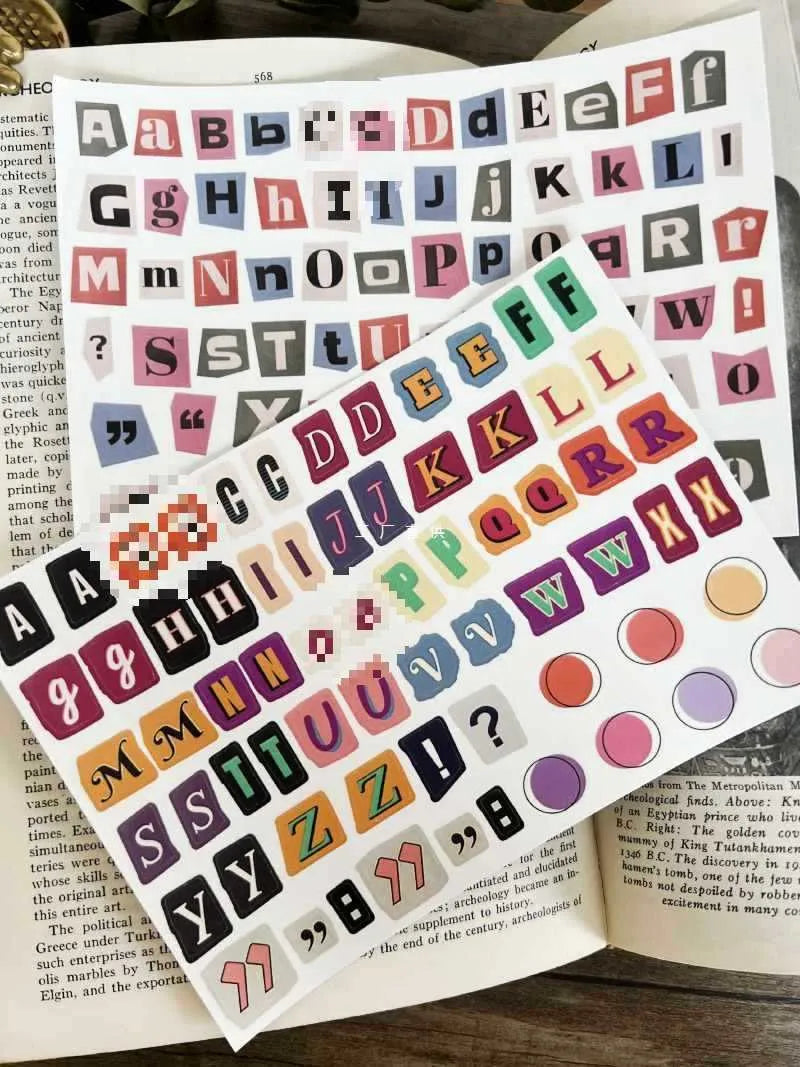 Set of decorative stickers showing English letters, numbers, and weekly words in a cute printed style.