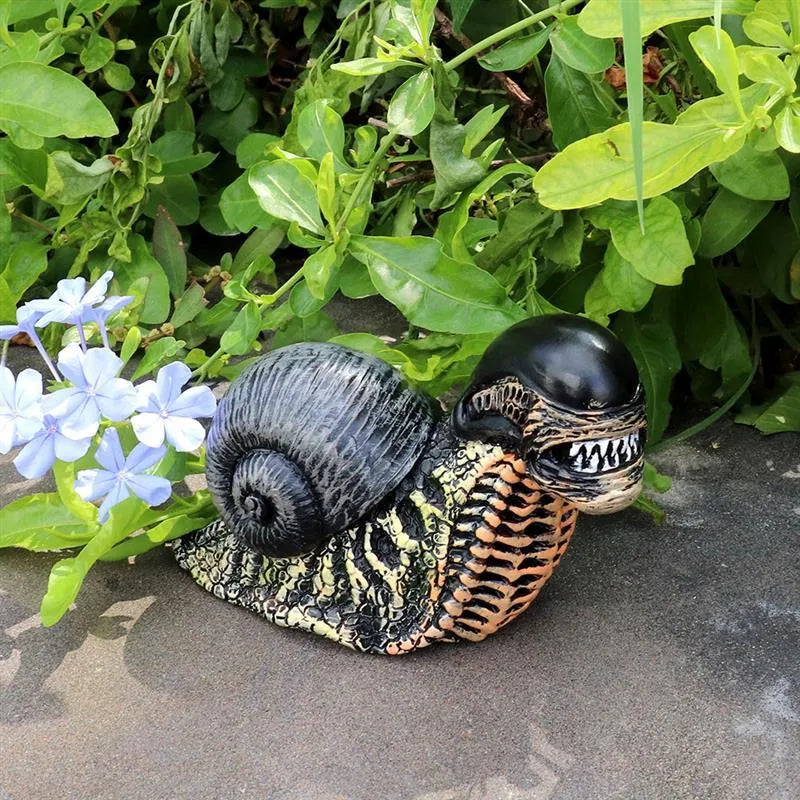 Resin garden snail sculpture with character design and coloured finish