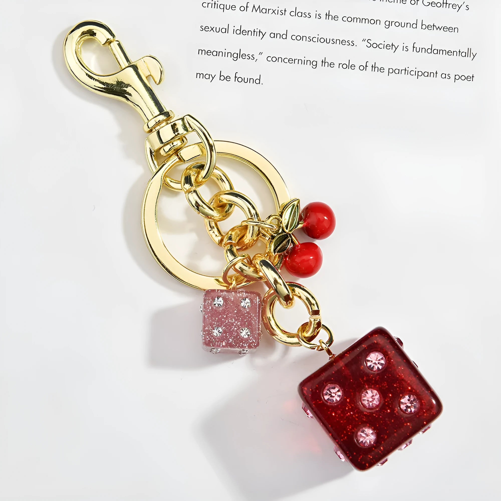 Vintage-style metal keychain with a square cherry red and white two-tone dice pendant on a metal ring.