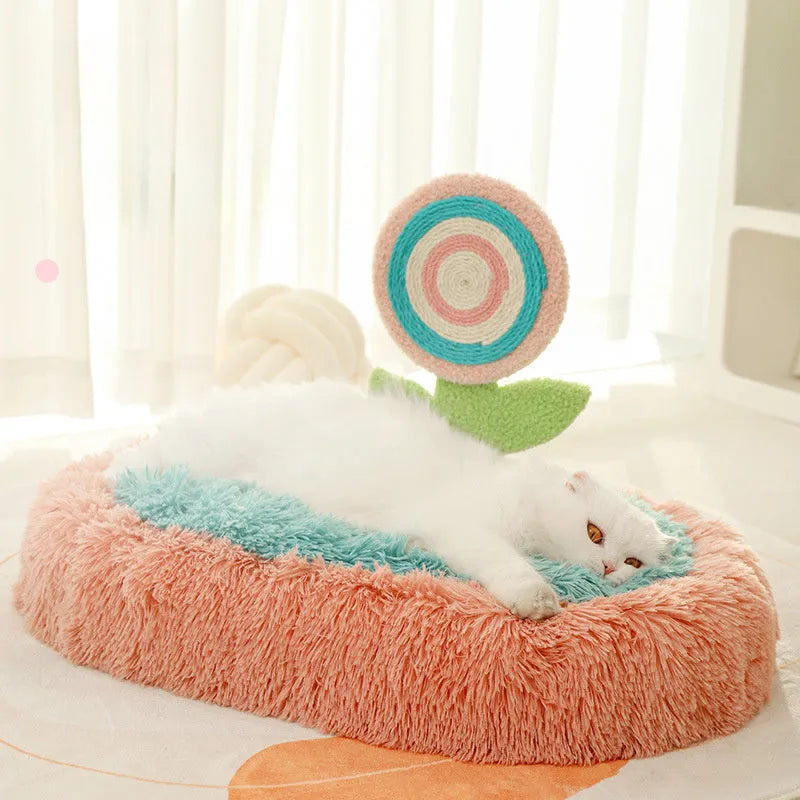 Pink elliptical cat nest bed with thick plush lining and a removable cover