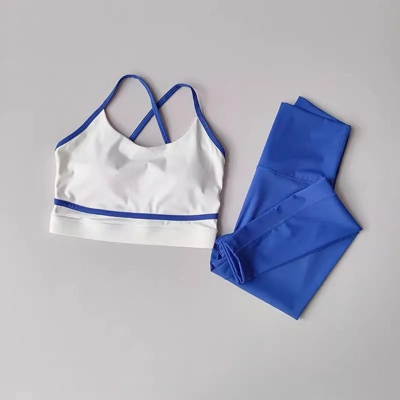 Women's blue and white sleeveless tank top and cropped nylon spandex leggings sportswear set