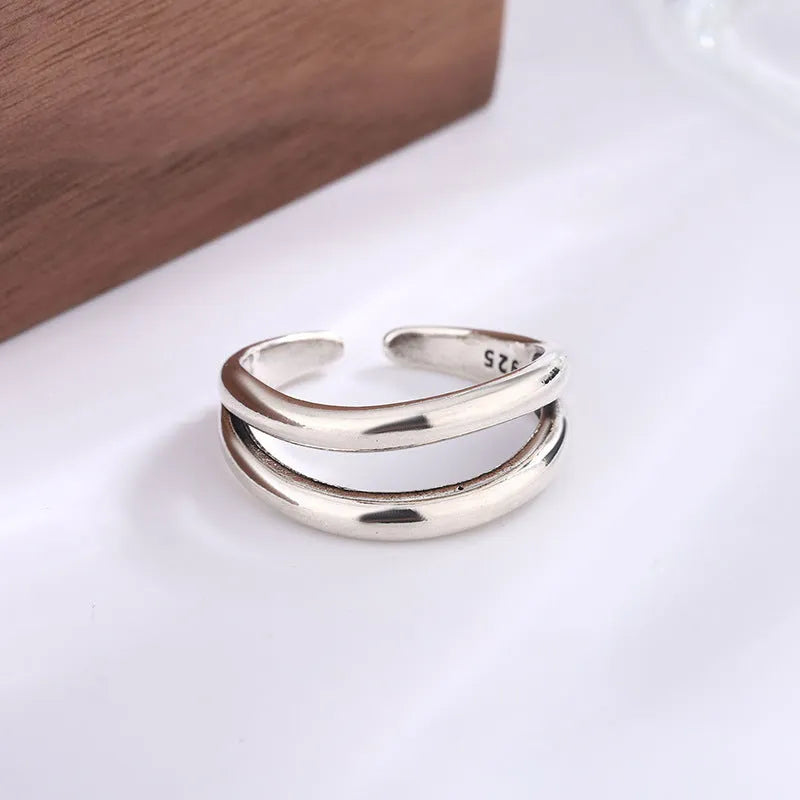 Women's retro copper double layer hollow geometry ring with adjustable opening.
