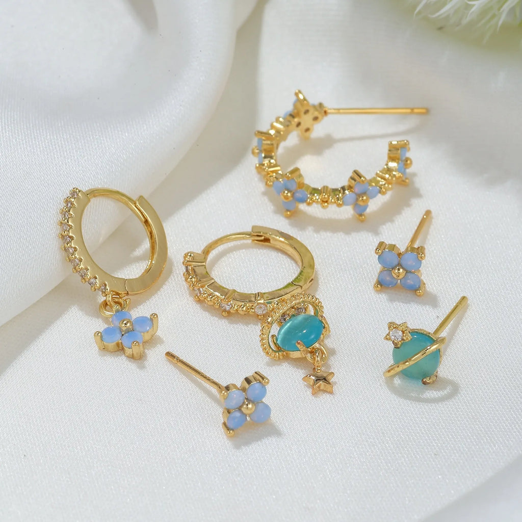 Gold and silver flower-shaped ear studs with zircon mosaic detail, Japanese Korean sweet girl style.