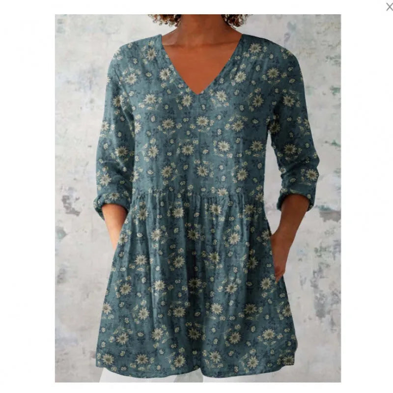 Women's printed loose dress with wide waist and 3/4 ruffle sleeves in a floral wave pattern.