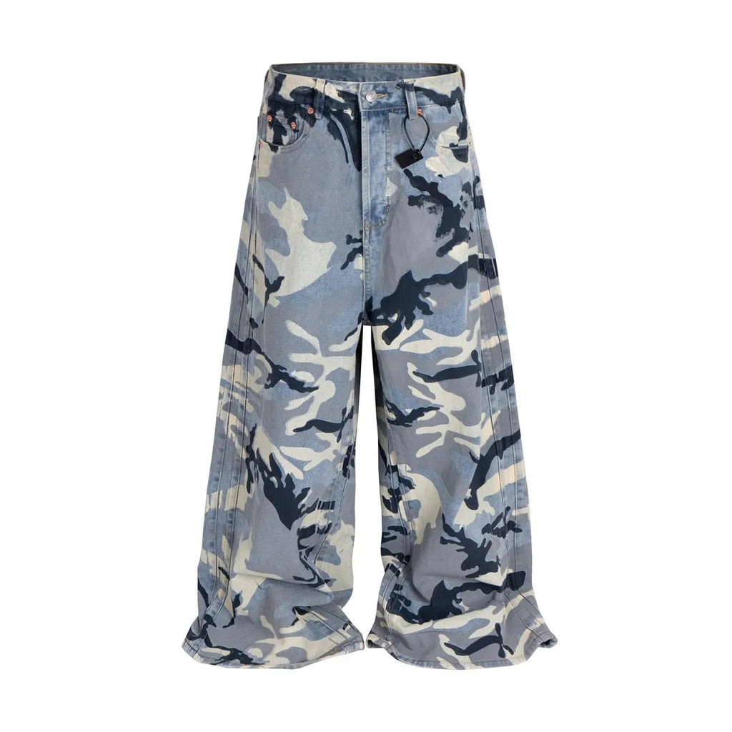 A pair of loose-fit blue jeans with a snow camouflage pattern on a mannequin.