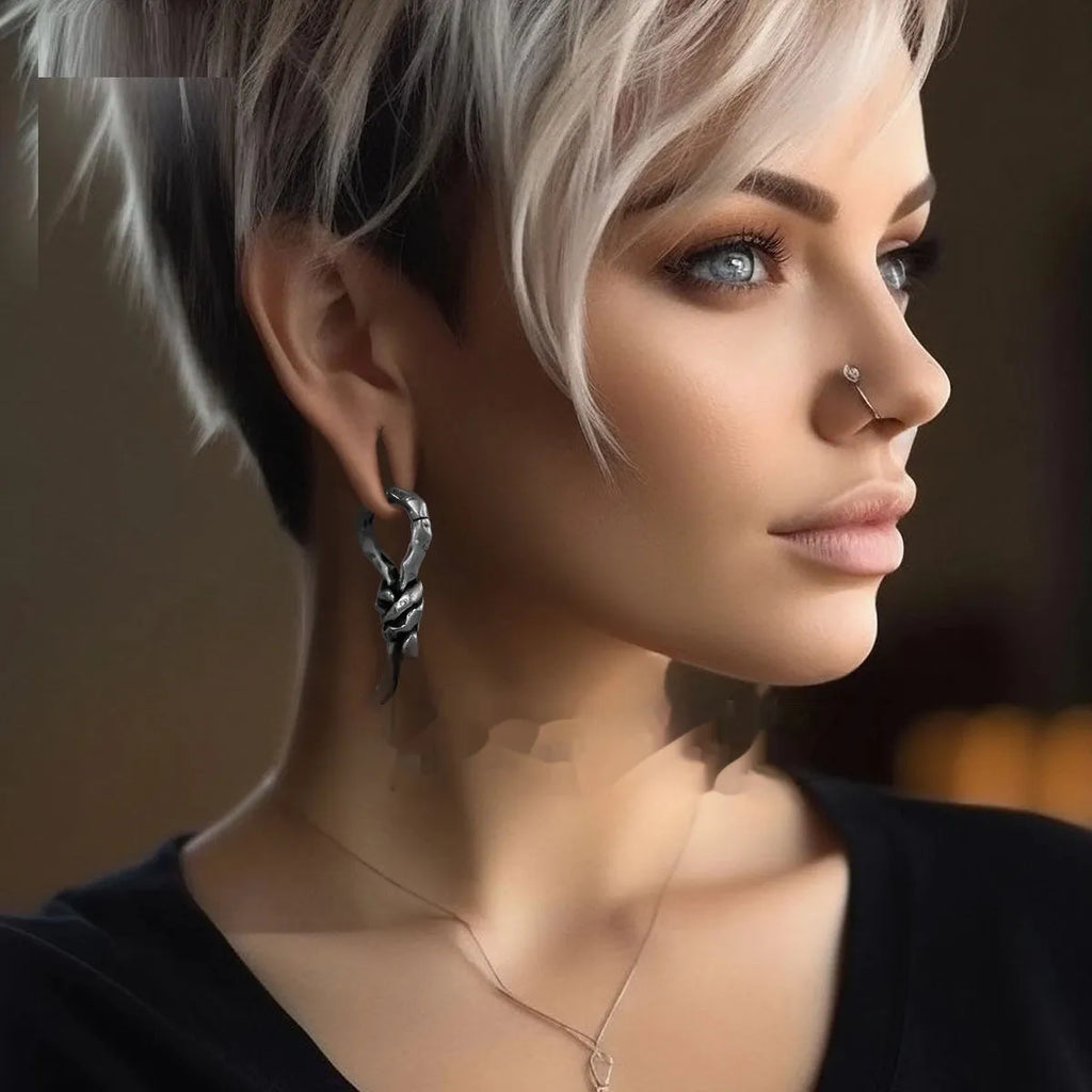 Close-up of a single 4mm copper piercing earring with a retro bending and connecting shape.