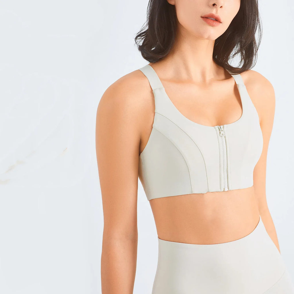Zip front sports bra in Rhino Grey with racerback and mesh back panel for breathability