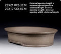 Handmade antique oval bonsai flower pot in purple sand clay, showing its 25cm length and 6.3cm depth.