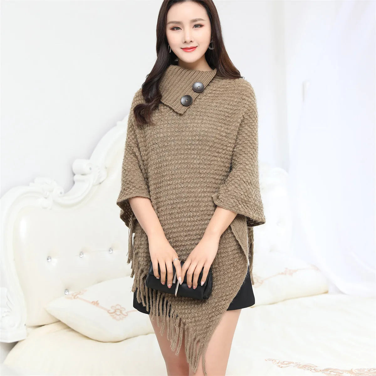 Sleeveless acrylic fibre cloak shawl in free size with dot pattern, shown in one of eight colour options