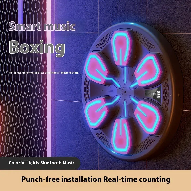 Black electronic boxing machine mounted on wall with USB charging cable