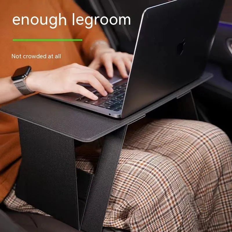 Foldable wooden laptop stand in black, raised on a desk with space underneath