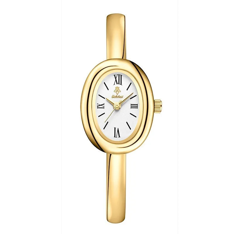 Women's gold and silver oval retro quartz watch with spiral patterns on a 8mm thick case.