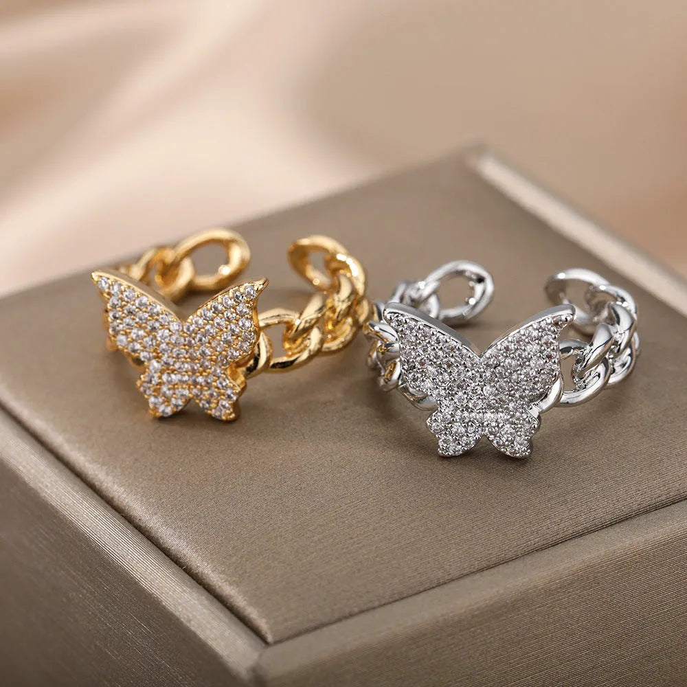 Personality zircon butterfly ring with three-dimensional design in gold tone on a white background