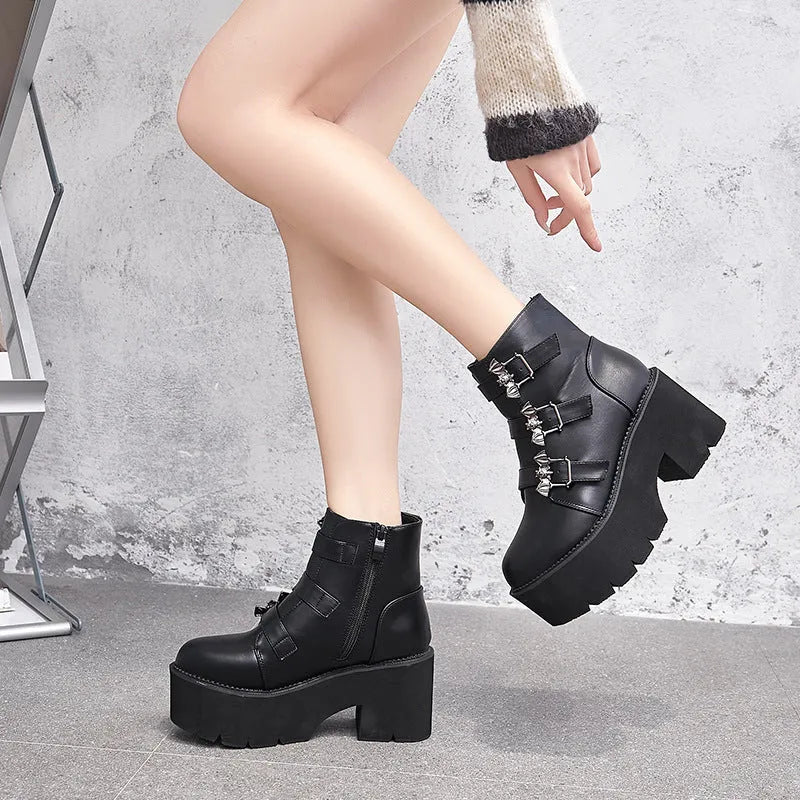 Black women's punk gothic Martin boots with bat buckle and side zip.