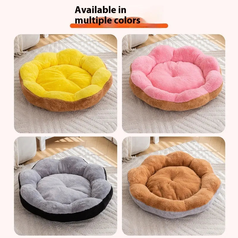 Round grey and black plush cat bed with a raised rim and a removable inner nest, shown on a wooden floor.