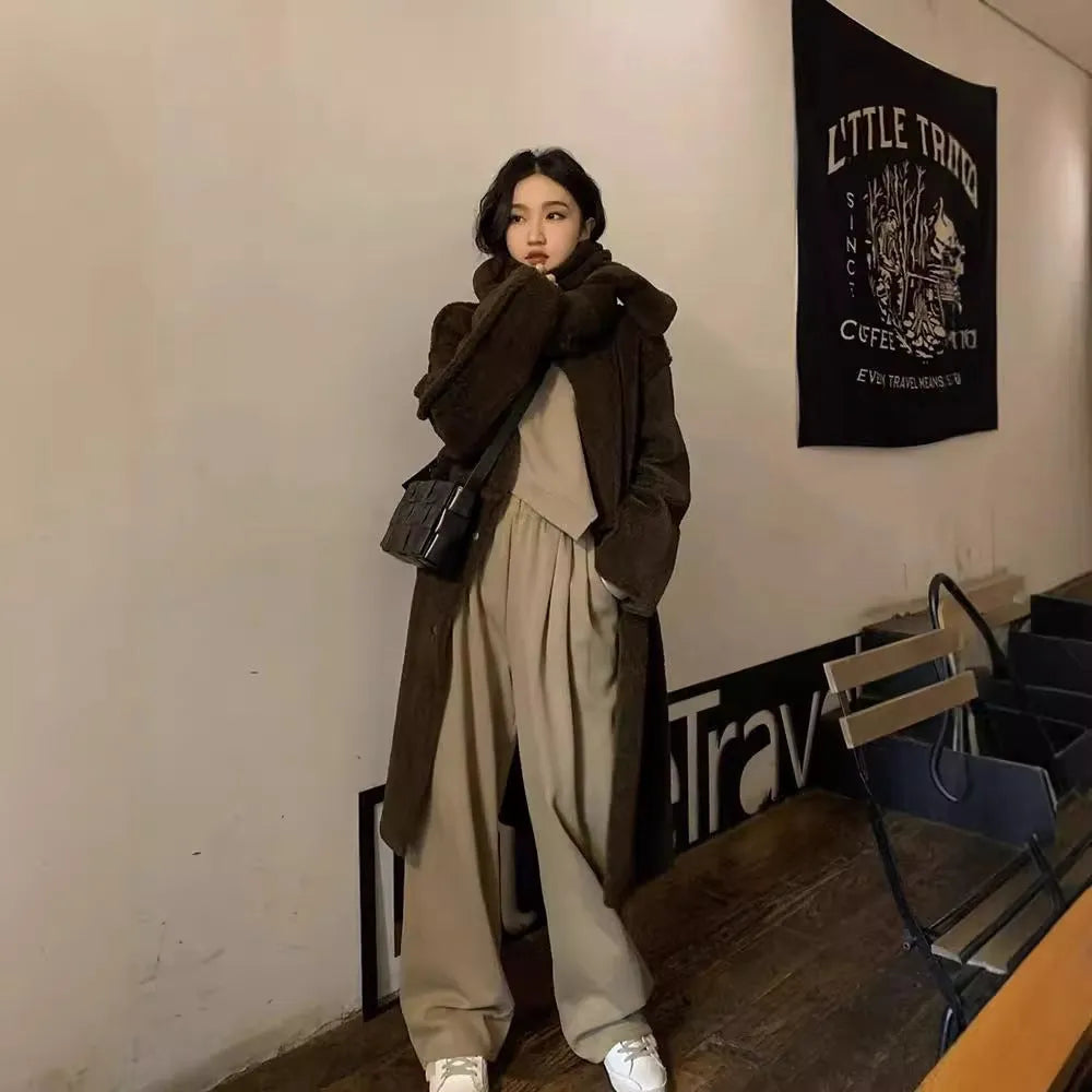 Women's khaki loose-fit polyester sports suit with long sleeves and full-length trousers.