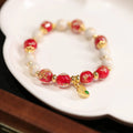 Women's ethnic style geometric bracelet with gold foil coloured glaze in Xingshi design