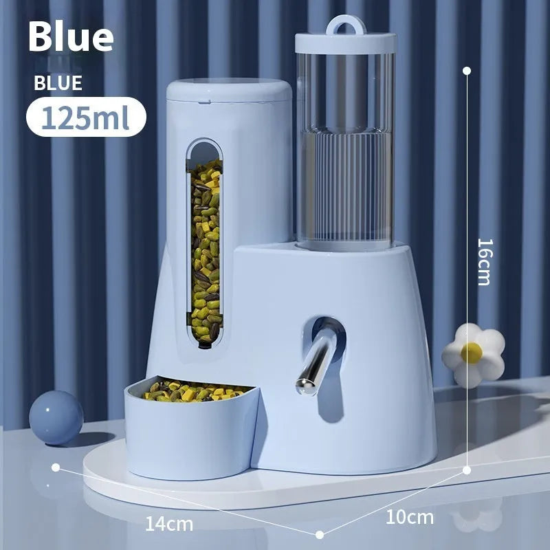 White, blue, and pink automatic hamster water feeder with attached food basin.