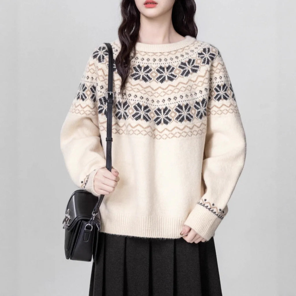 Women's milky white fair isle geometric pattern knit pullover sweater on a hanger.