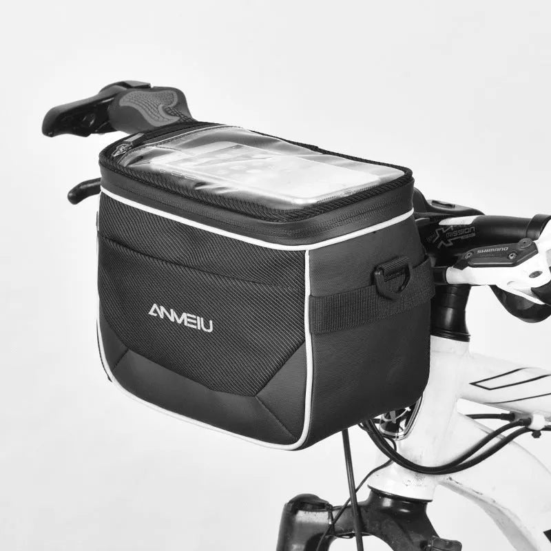 Black folding bicycle bag with hanging strap attached to handlebars