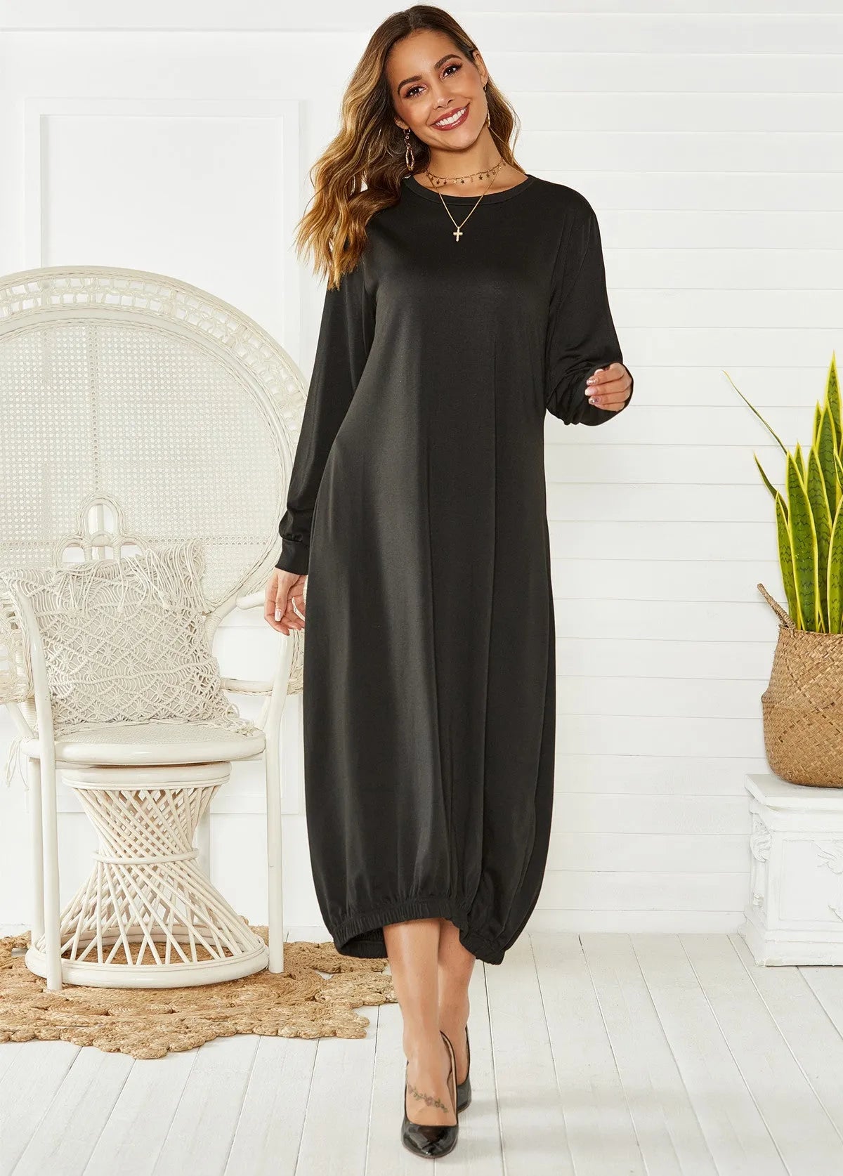 Black loose lantern dress with lace-up crew neck and elastic waist.