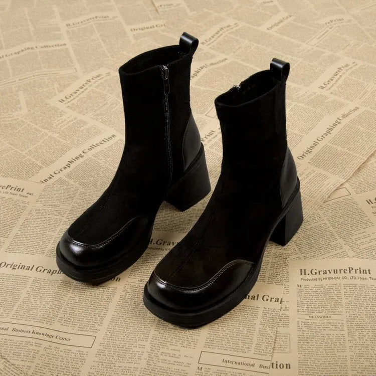 Women's black Martin boots with chunky heel and thick rubber sole, side view