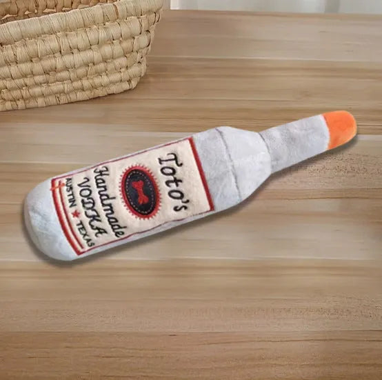 Brown plush wine bottle shaped dog toy with squeaker for puppies and small dogs