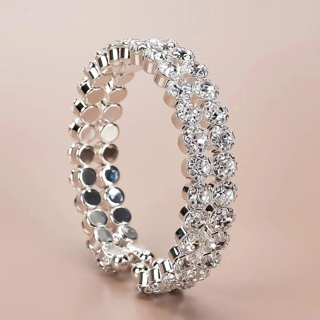 Silver elastic bracelet with double row of large rhinestones and wide opening design