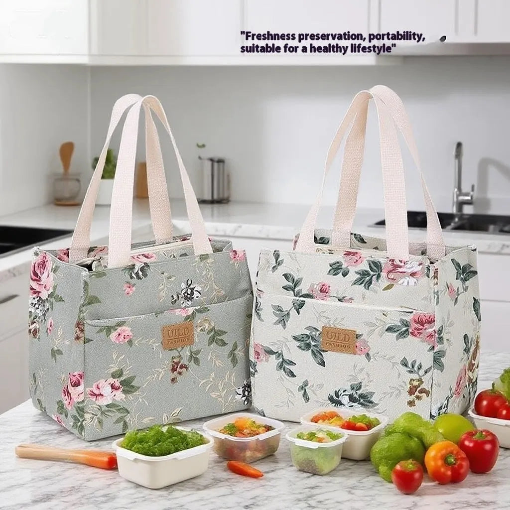 Women's printed canvas handbag with an aluminium handle in a floral design colour.
