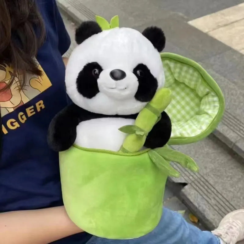 Black and white panda plush doll holding a simulated bamboo tube, a soft decorative cushion.