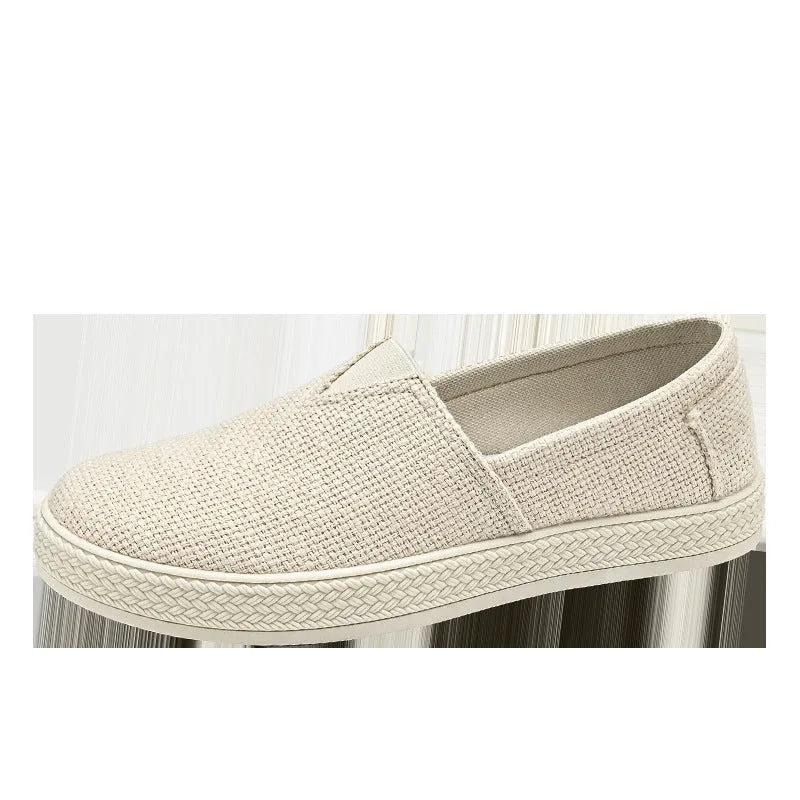 Men's beige linen canvas shoes with round toe and shallow mouth on a PVC sole.