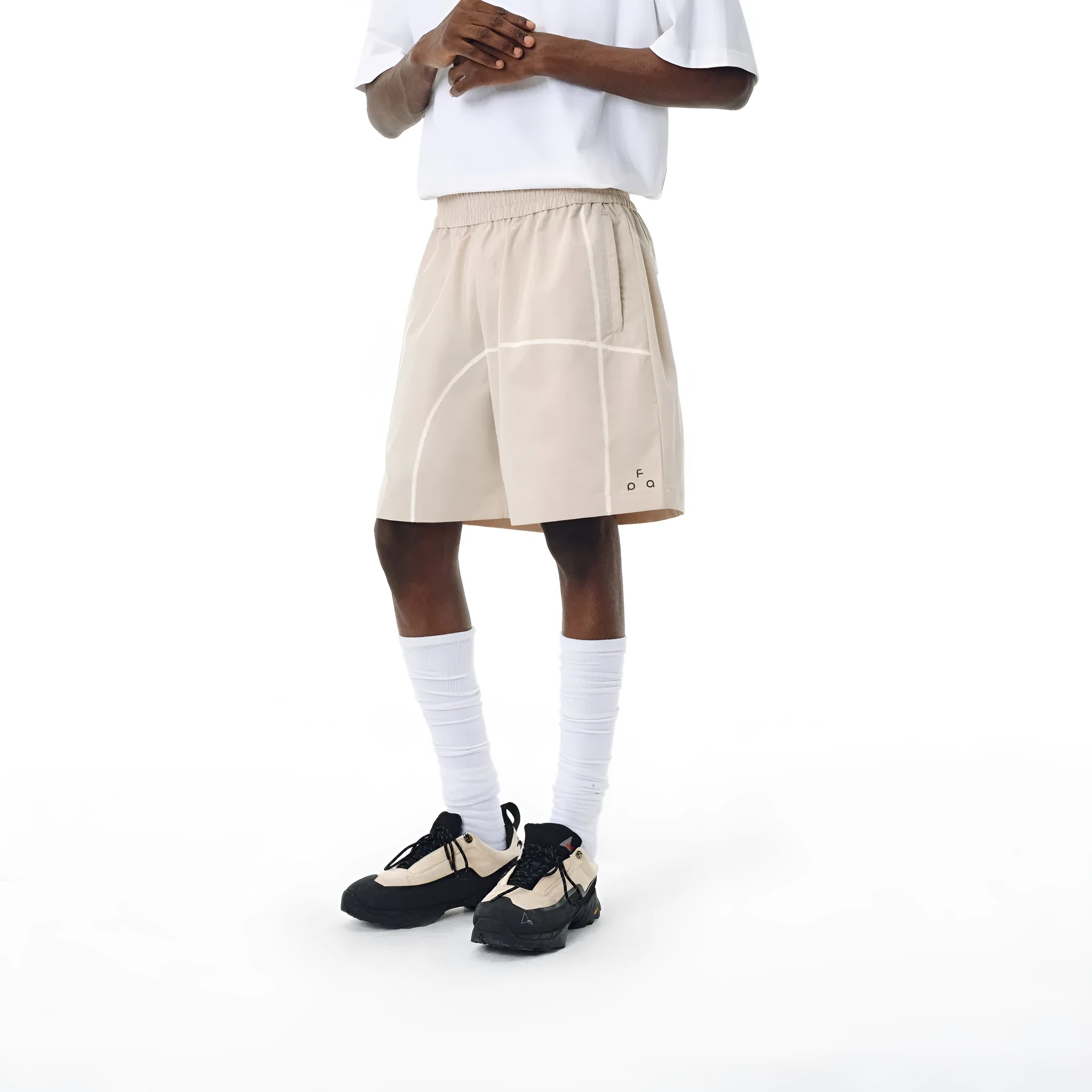 Functional drawstring shorts in dark grey, white and apricot colours with elastic waistband