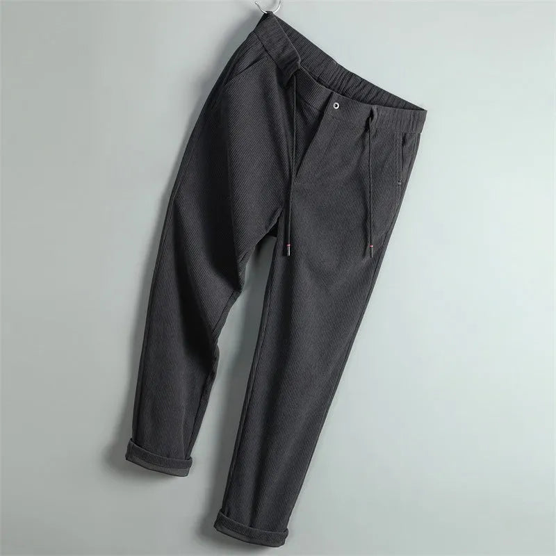 Men's striped casual trousers in black, dark blue, gray, dark khaki, or apricot, made of polyester, sizes 29-40.